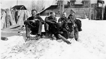 Employees of Island Mountain sitting in front of bunkhouse. Jum Brennan, George Marllene, Tom Munn, and unknown boy, wpH256