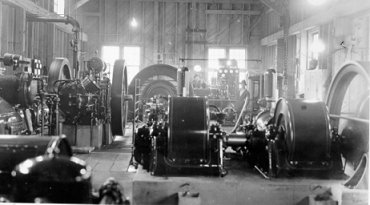 Interior, Powerhouse and Compressor House, Cariboo Gold Quartz Mine. in photo is Art Scott, Operator, and Bernard Gallie, Chief Electician, wpH324