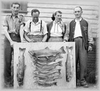 Local Wellsians holding up their catch, wpH437